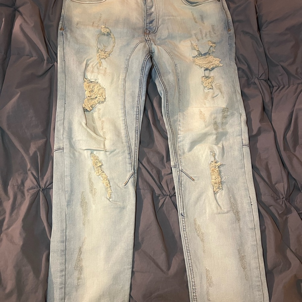 Distressed Light Wash Denim Jeans